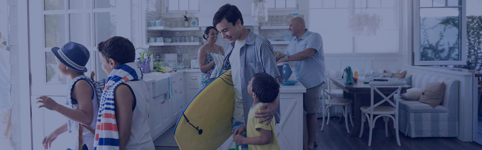 Family with body board and beach towel leaving beach house