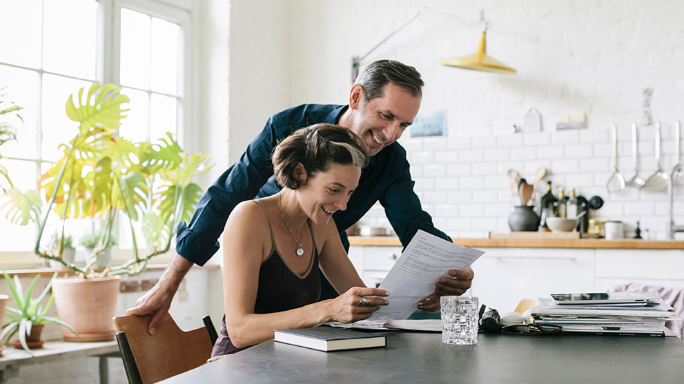 married couple excited about good tax information