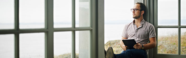 man stares out the window