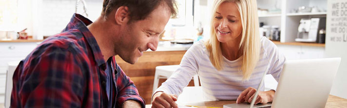 a couple discussing mortgage closing costs