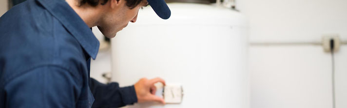 home inspector checking water heater