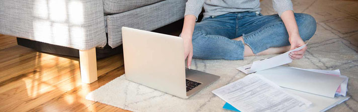 woman researching dti on her computer