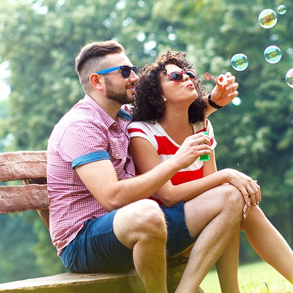 couple blowing bubbles