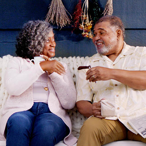 couple on porch having coffee