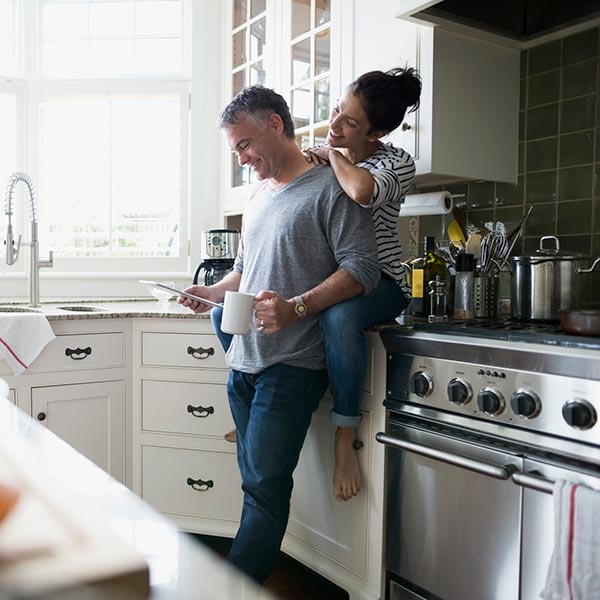 Couple in their kitchen