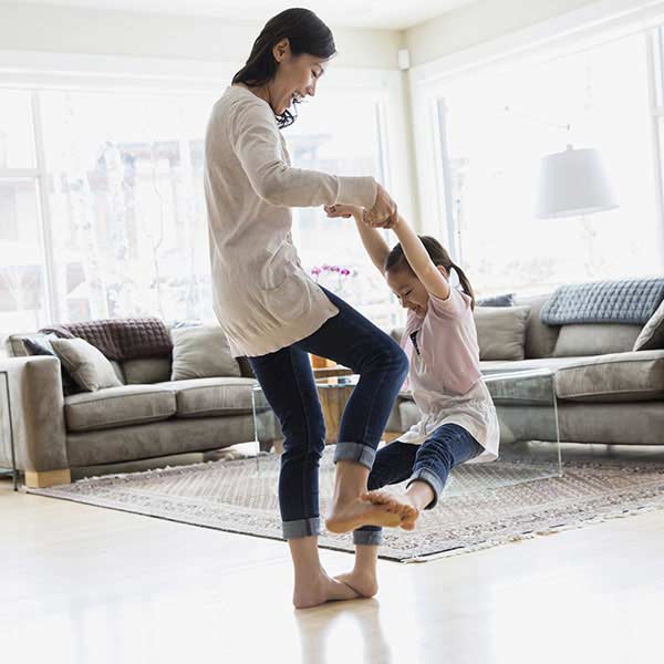 Mother playing with her daughter.