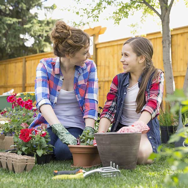 Mother gardening with her daughter