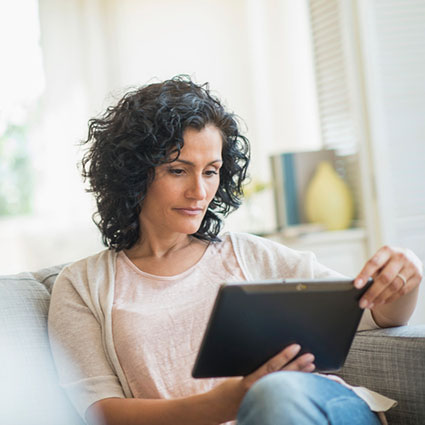 Woman studying tablet computer