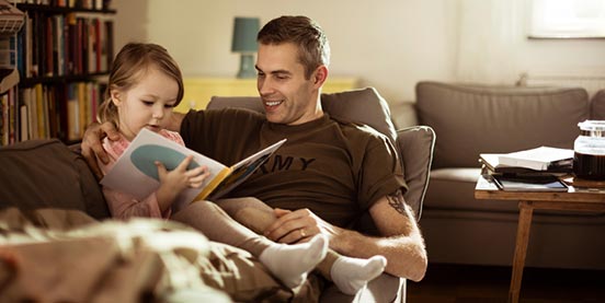 father and daughter reading together